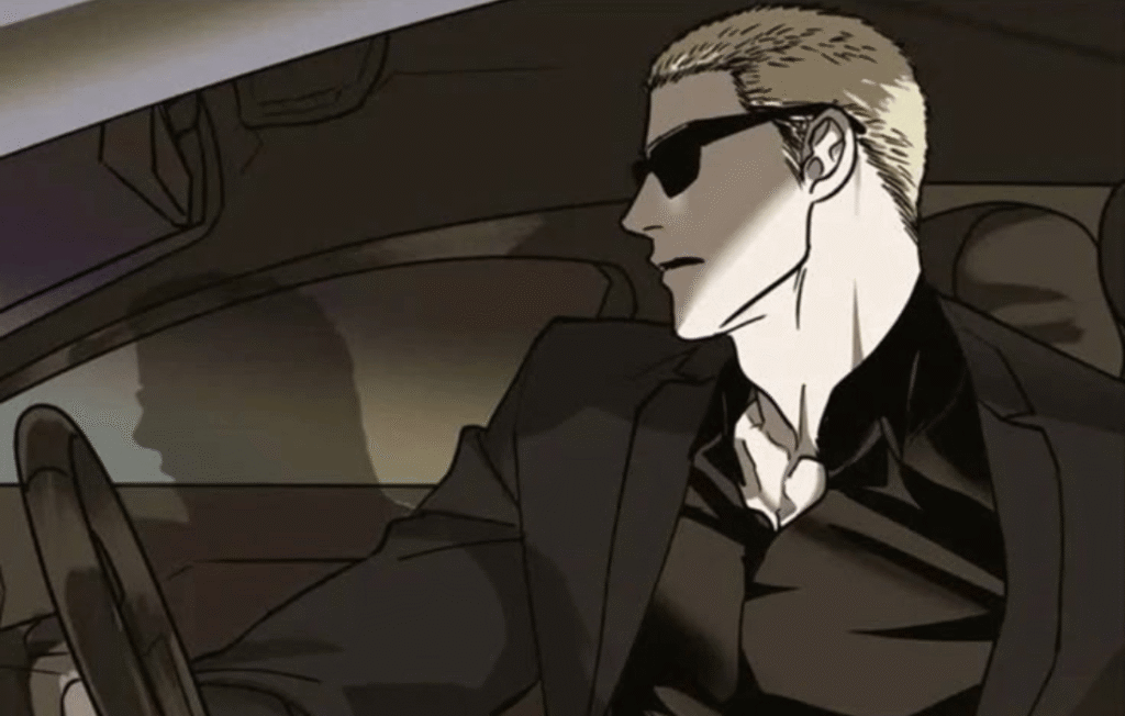 Shutline Jake wearing sunglasses while driving a car.