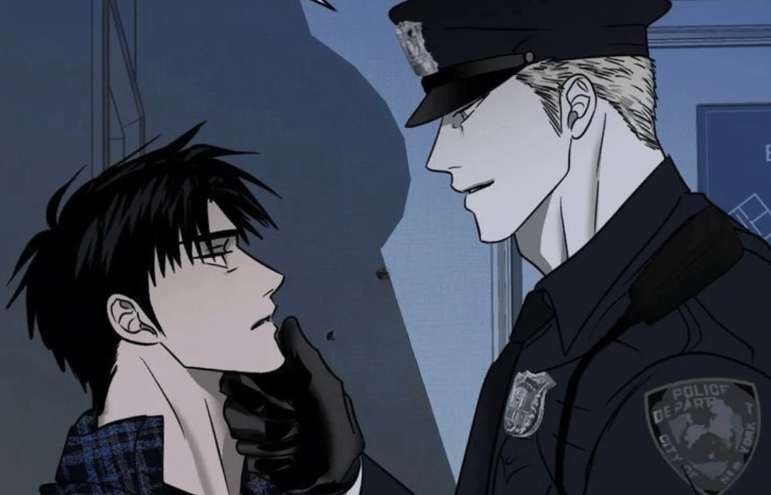 An officer in black gloves lifting a young man's chin in bato shutline.