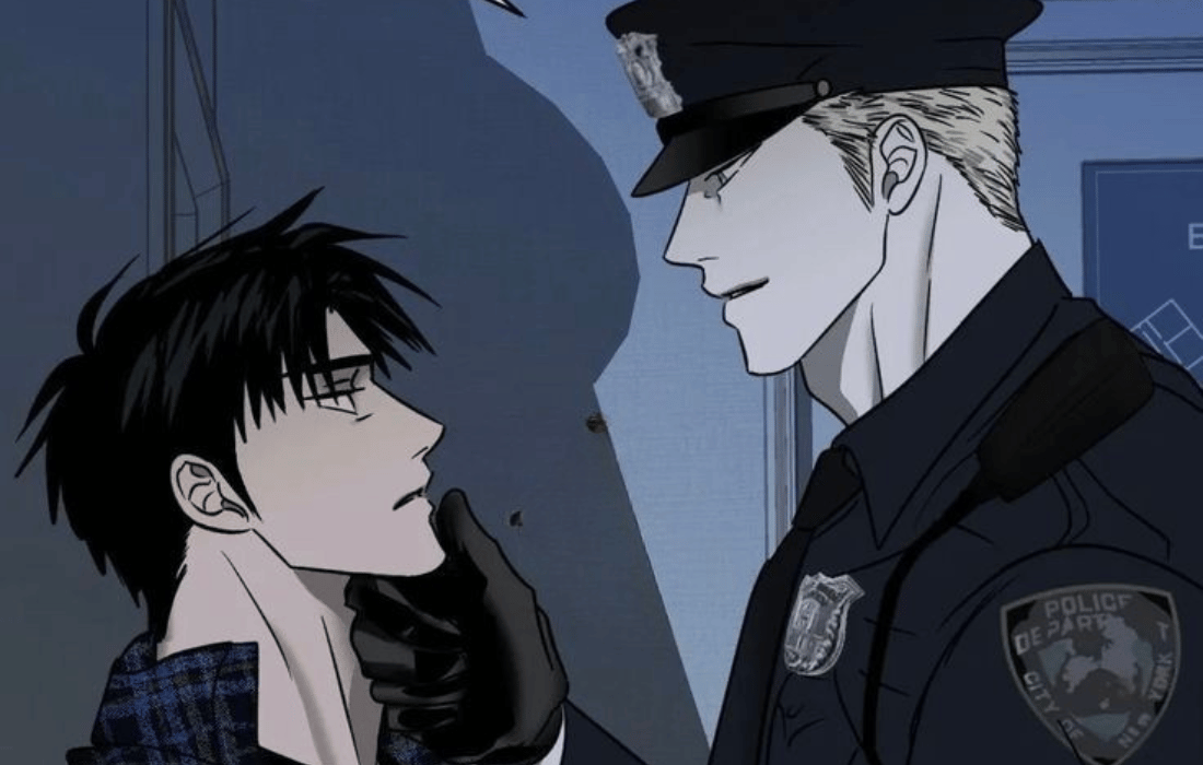 An officer in black gloves lifting a young man's chin in bato shutline.