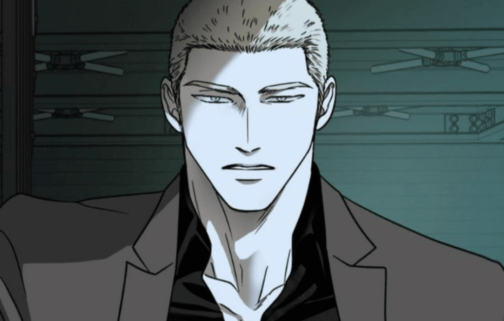 Jake from Shutline in a grey suit and black shirt.