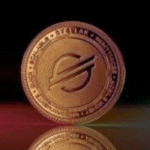 Stellar lon: xlm gold cryptocurrency coin on reflective surface.