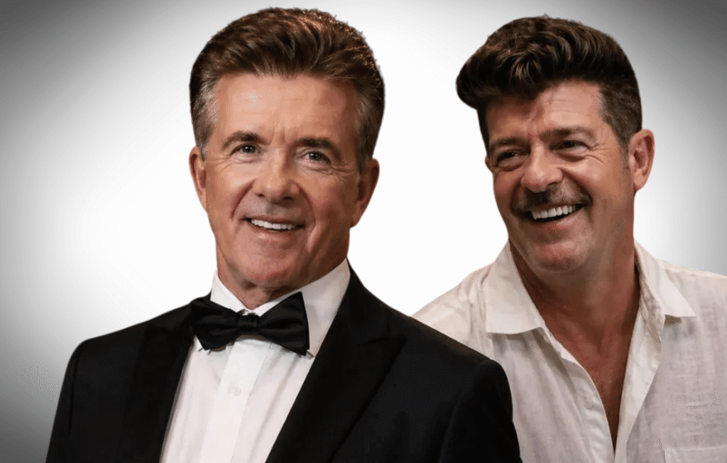 Burt Thicke in a black tuxedo alongside singer Robin Thicke smiling against a gray background