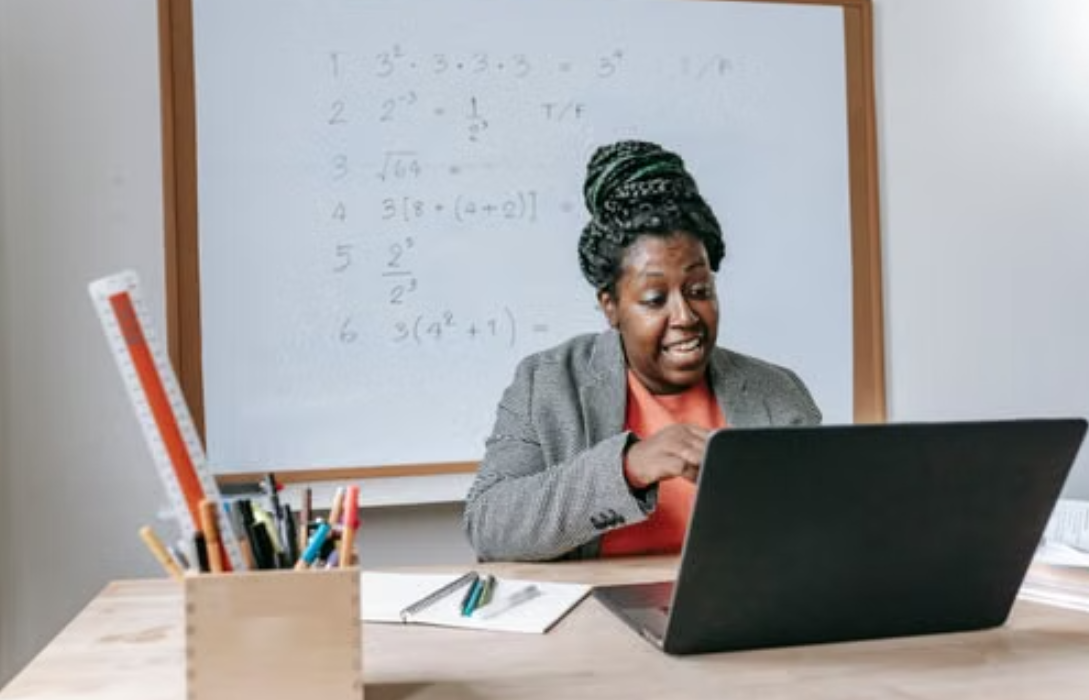 Teacher conducting online math class for Sean story guide.