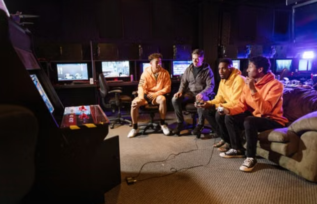 amers playing arcade and console games together.amers playing arcade and console games together.