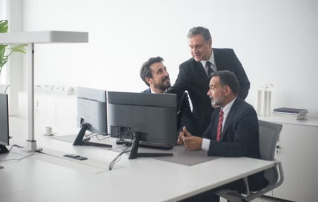 Global Trader Programme executives discussing trade strategy.