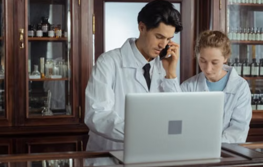 Pharmacists reviewing patient details for Medicines Ethics.