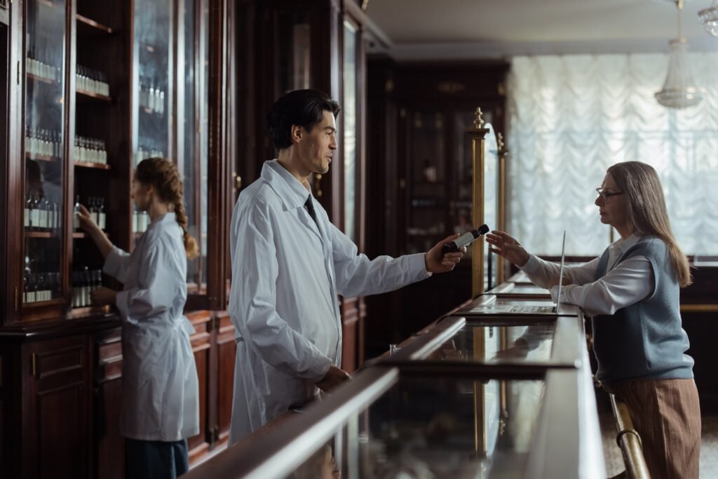 Pharmacist handing medication to a customer at a vintage pharmacy counter, adhering to Medicines Ethics and Practice guidelines.
