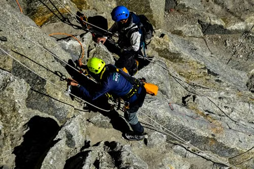 Action Sports OG60 Fluorescent Orange shown during an outdoor climbing activity.